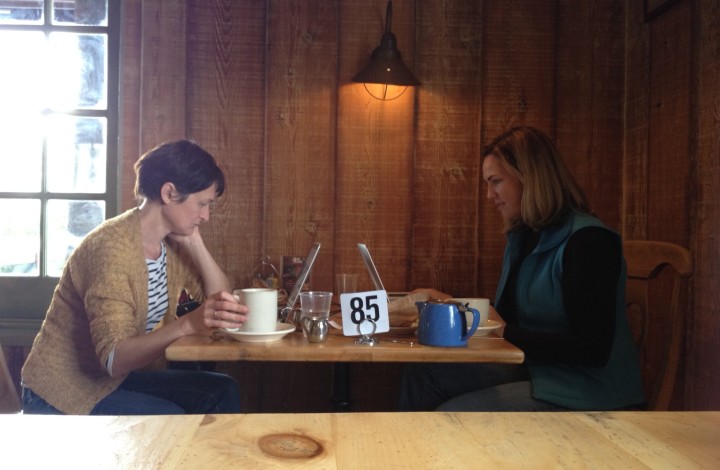 two writers at a cafe