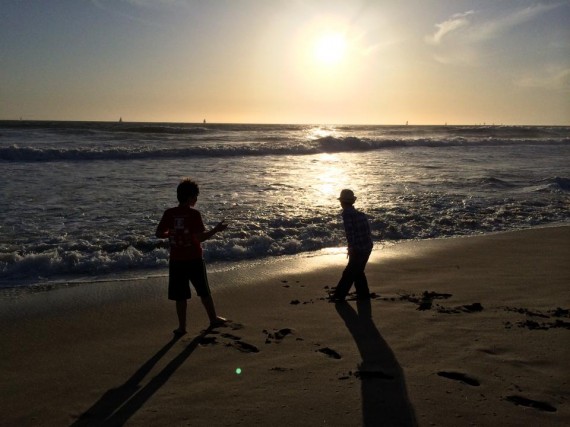 boys at oxnard beach sunset