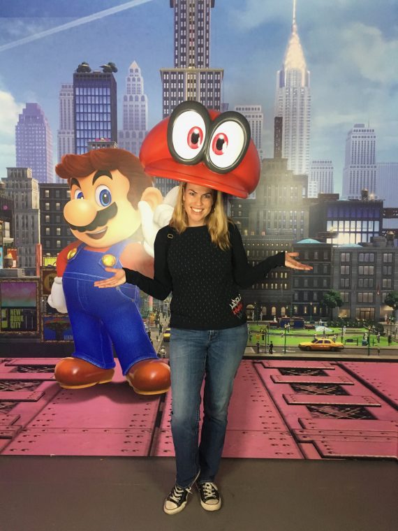 woman under giant Mario hat