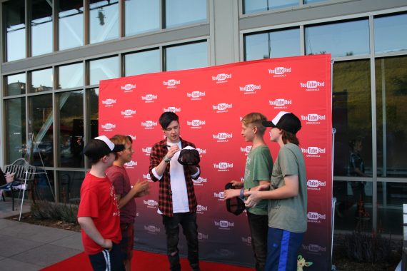 DanTDM signs kids hats