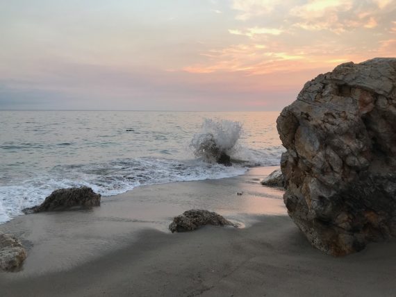westward beach ocean wave rocks
