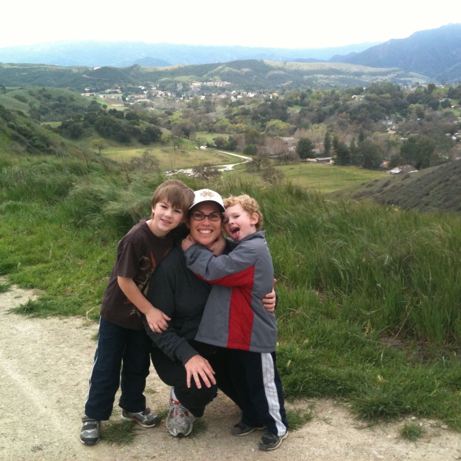 A mom and two little boys at the top of a hiking trail in Agoura Hills